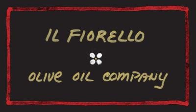 A black sign with the words il fiorello and olive oil company written in yellow.